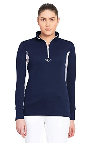 Person wearing navy quarter-zip sweater with white accents.