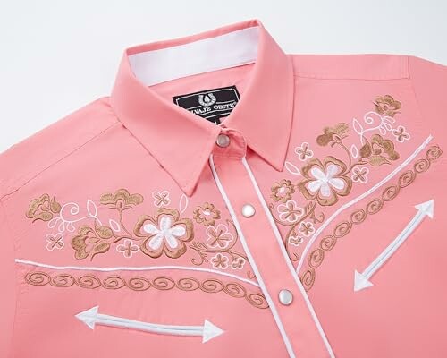 Pink western shirt with floral embroidery and arrow details.