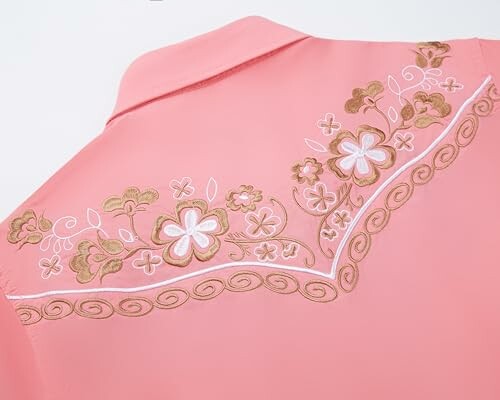 Back of a pink shirt with floral embroidery.